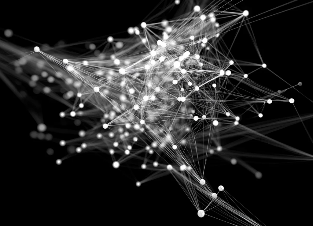 Visualisation abstraite de points reliés par des lignes blanches sur fond noir.